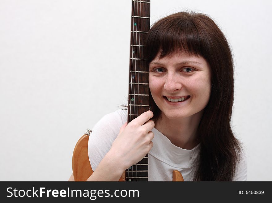 Portrait of a girl holding an electric guitar. Portrait of a girl holding an electric guitar