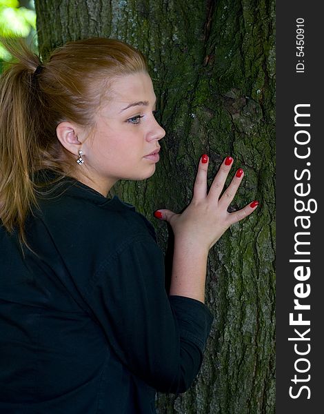 Portrait of the beautiful young girl on nature