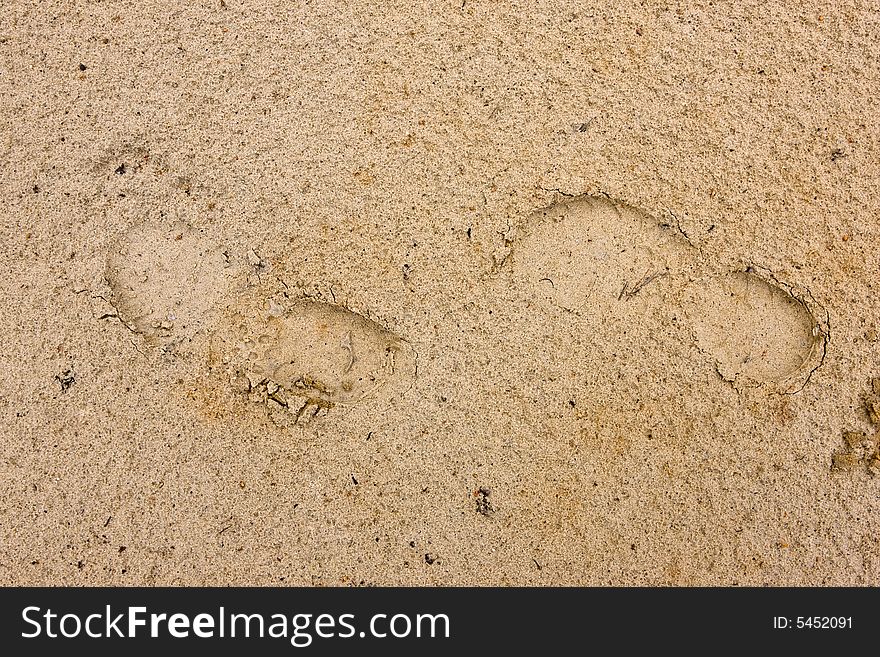 Footprints going over a sand