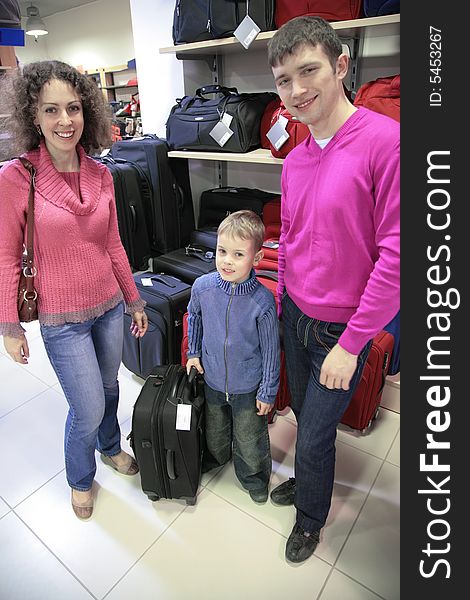 Family Buys Suitcase In Shop