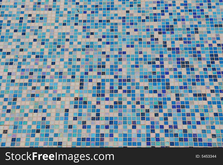 The mosaic ground of a swimming pool. The mosaic ground of a swimming pool.
