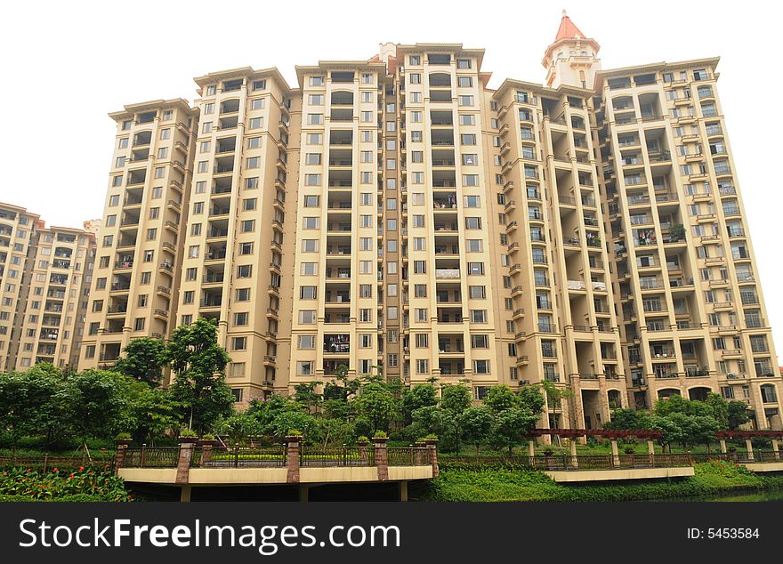 A high rise apartment building with a lot of windows and balconies. A high rise apartment building with a lot of windows and balconies.