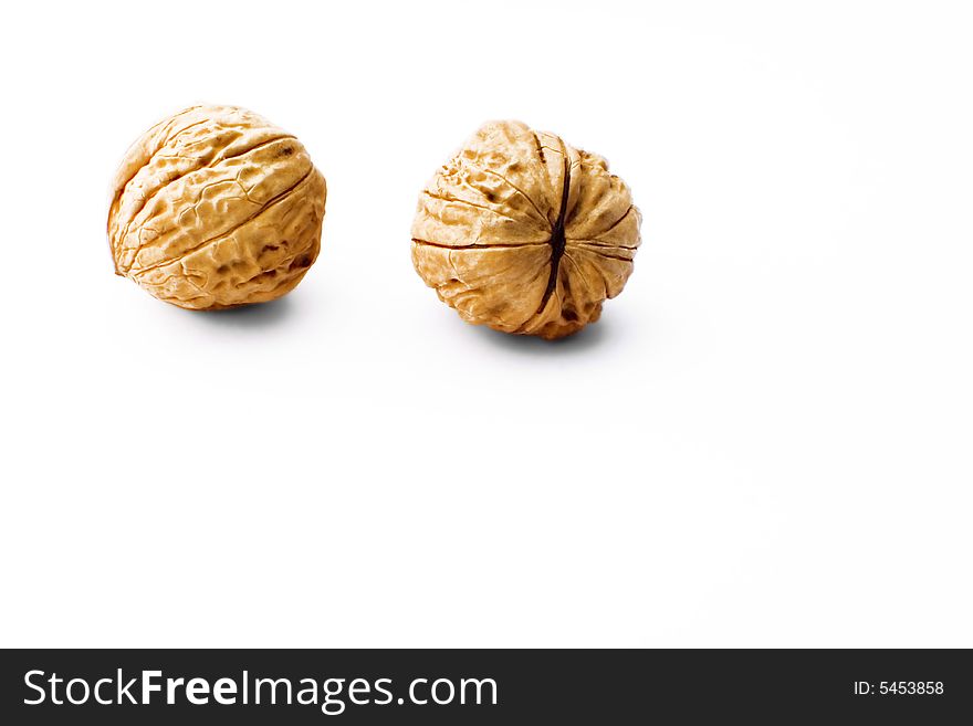 Two walnuts isolated on white background