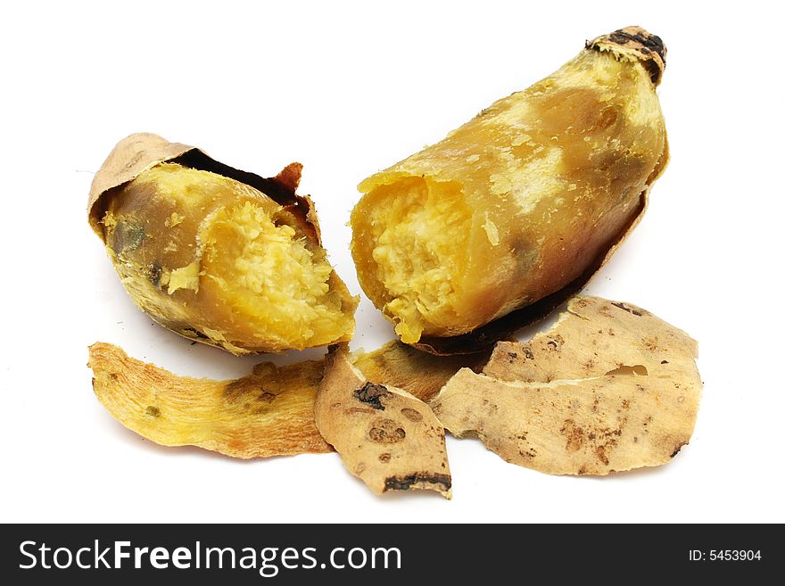 A steamed sweet potato peeled into half on white background.