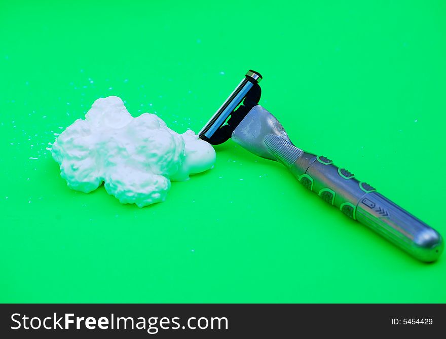 Shot of a razor and shaving foam. Shot of a razor and shaving foam