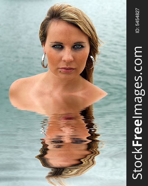 Beautiful woman reflected in water. Beautiful woman reflected in water