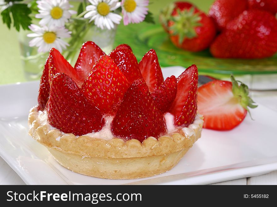 Strawberry cake with pudding on a plate