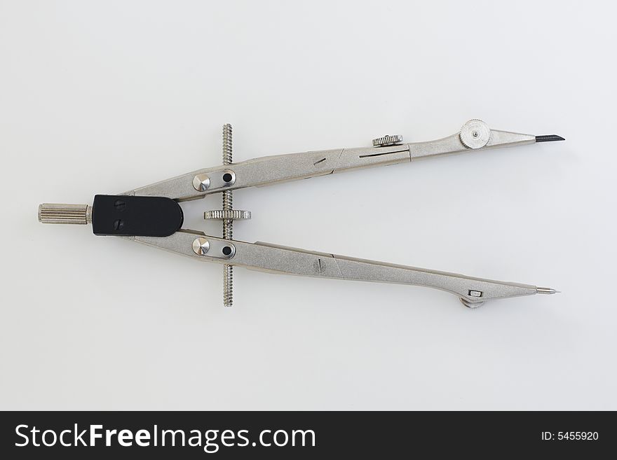 A pair of compasses, a drafting instrument used to draw circles. A pair of compasses, a drafting instrument used to draw circles