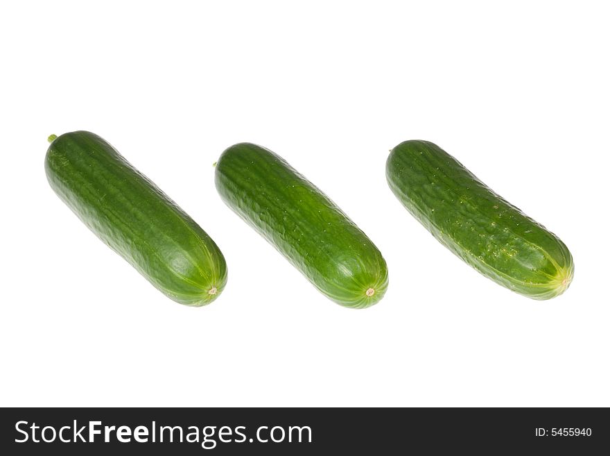 Three cucumbers on a white background. Three cucumbers on a white background.
