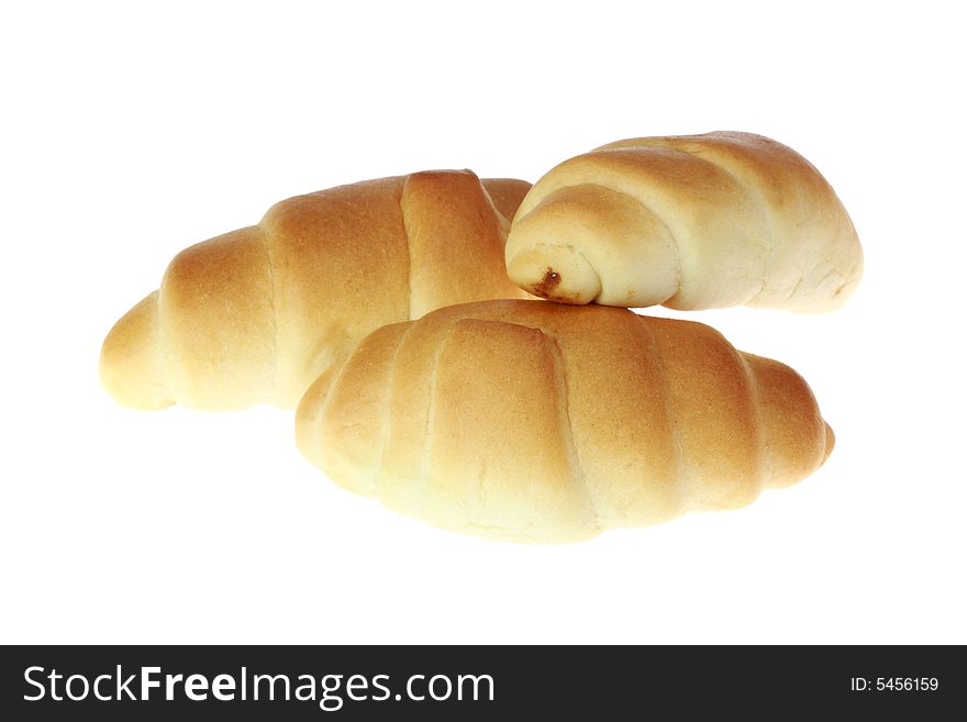 Three croissants isolated on a white background. Three croissants isolated on a white background.