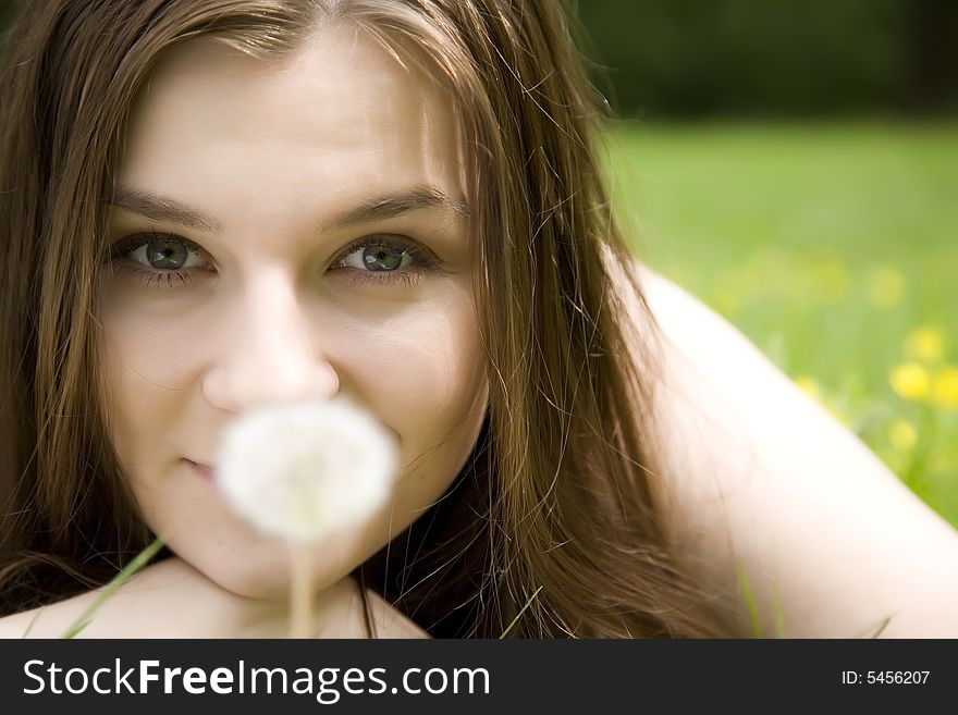 The Girl Looking On White Dandelion. The Girl Looking On White Dandelion