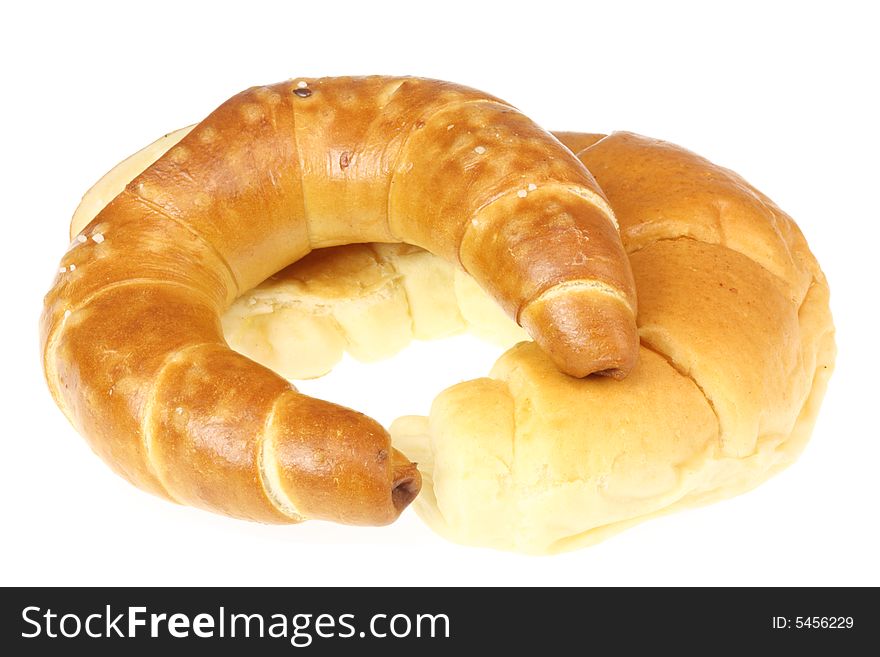 Two croissants isolated on a white background. Two croissants isolated on a white background.