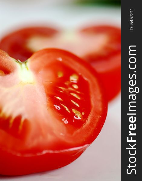 Sliced fresh red tomato isolated