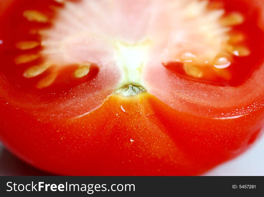 Sliced fresh red tomato isolated