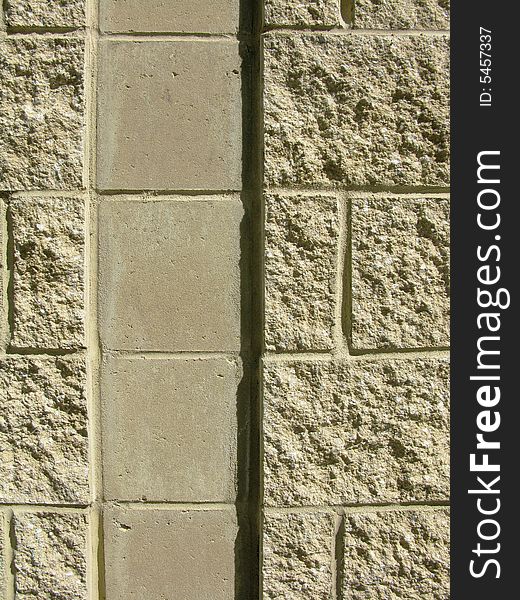 Vertical close-up of concrete block wall with vertical channel. Vertical close-up of concrete block wall with vertical channel