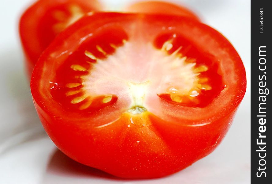 Sliced fresh red tomato isolated