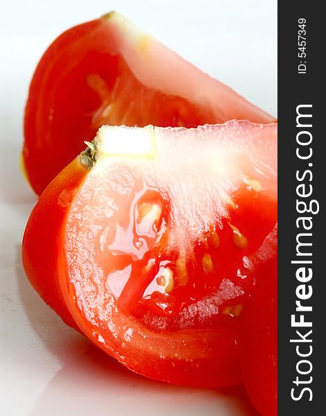 Sliced fresh red tomato isolated