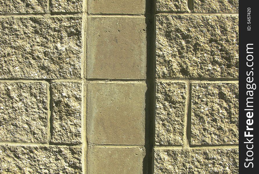 Horizontal close-up image of concrete block wall with vertical channel. Horizontal close-up image of concrete block wall with vertical channel