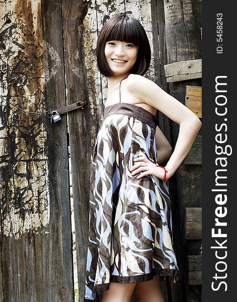 A Chinese girl by the ancient door,this ancient village has 500 years of history