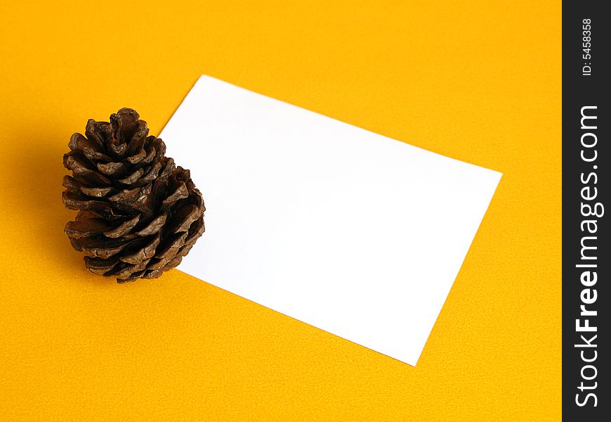 Gift card with a pine cone on a yellow background