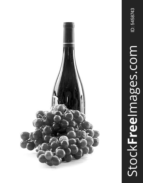 Beautiful black and white stark image of grapes turning into a wine bottle. Beautiful black and white stark image of grapes turning into a wine bottle