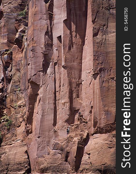 Rock climbers climbing a wall in Zion National Park, Utah. Rock climbers climbing a wall in Zion National Park, Utah.