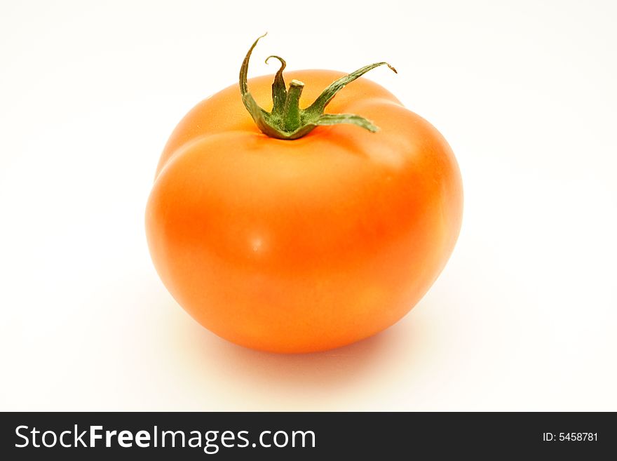 One red fresh ripe Tomatoe