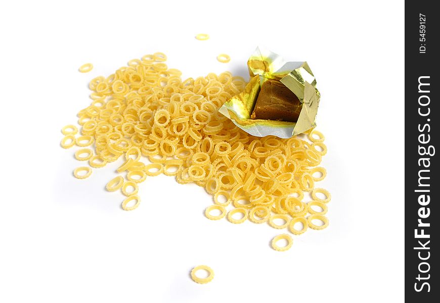 Pasta to Soup with a block of 	
dehydrated flavor on a white background. Pasta to Soup with a block of 	
dehydrated flavor on a white background