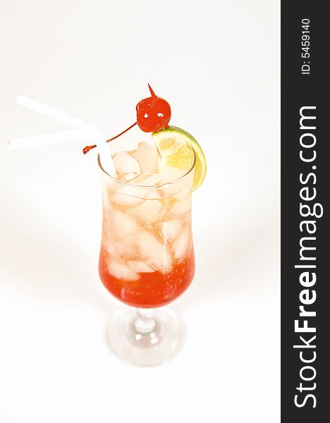 Refreshing red strawberry cocktail served with ice and lemon