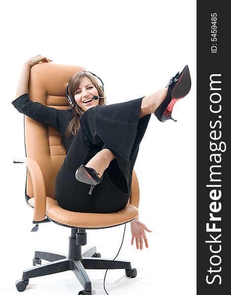 Young business woman on armchair Speaks by phone.