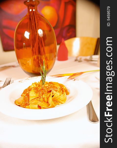 Parpadelle pasta with chicken or rabbit meat and tomato sauce. Parpadelle pasta with chicken or rabbit meat and tomato sauce