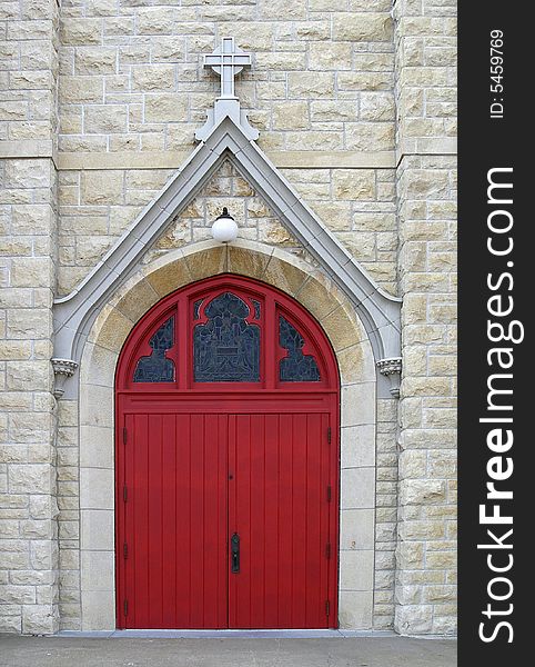 Episcopal church door, red with stained glass above. Episcopal church door, red with stained glass above.