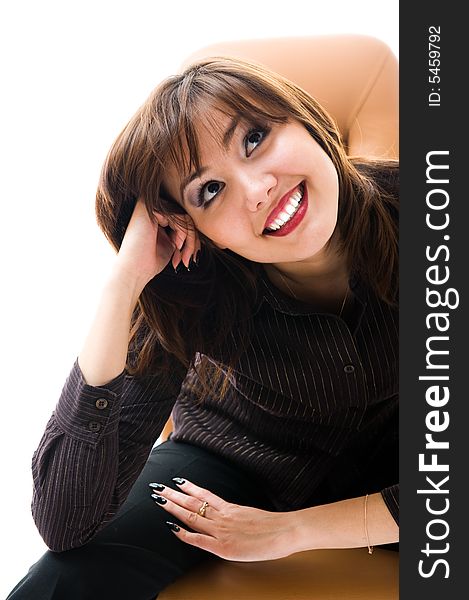 A young japanese woman smile. Sitting in an office armchair. Isolated over white