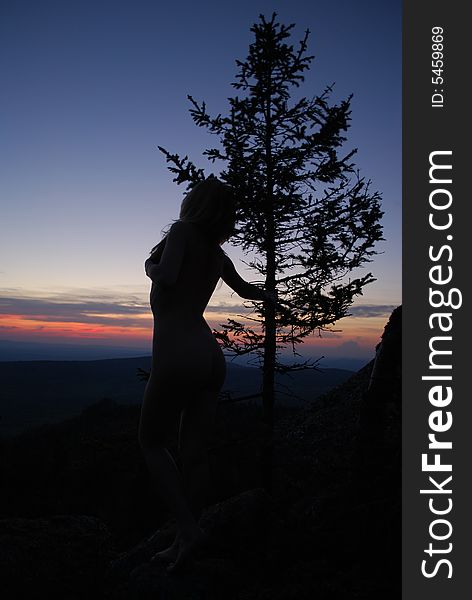 Sundown, tree & sexy woman in mountains