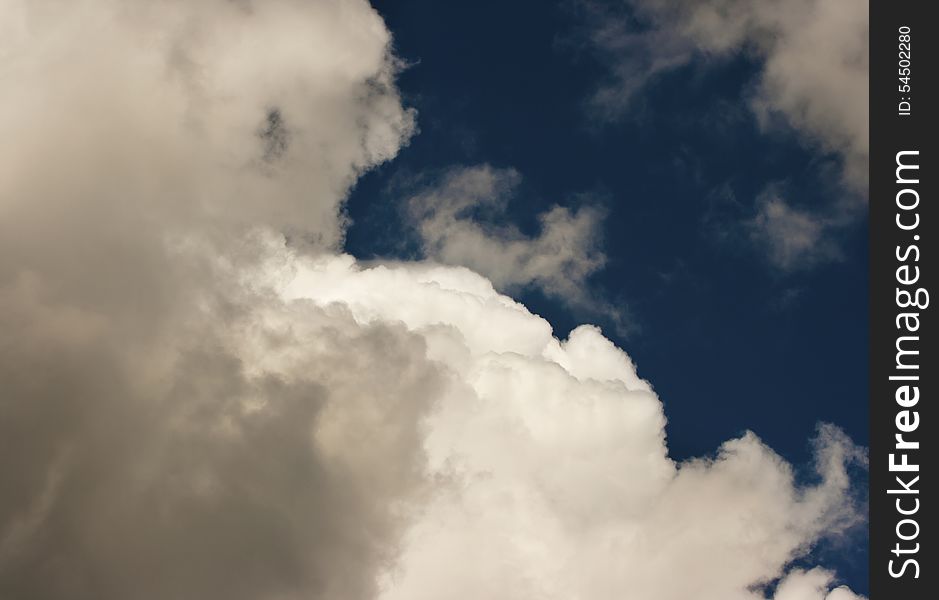 Thick white cloud in the blue sky on sunny day