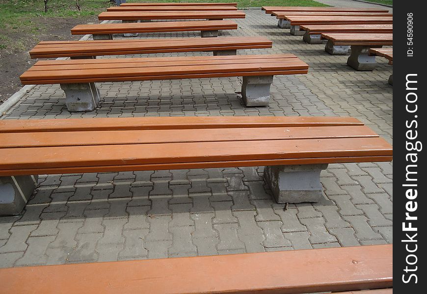 Benches together standing in a row seating. Benches together standing in a row seating.