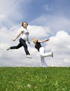 The Two Happy Jumping Girls Stock Photos The Two Happy Jumping Girls Stock Photos