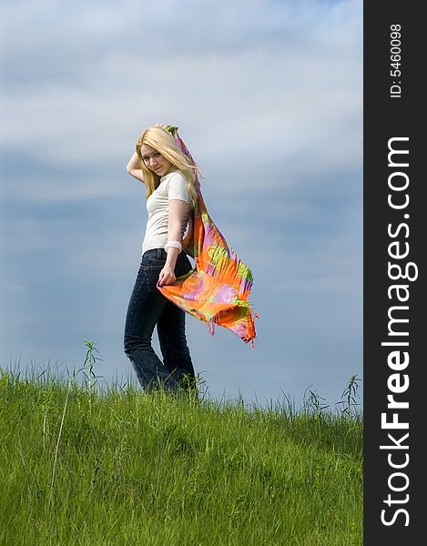 Girl with  scarf stand on a wind. Girl with  scarf stand on a wind