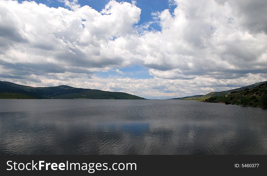 Lake with blue cloudy sky, Bulgaria. Lake with blue cloudy sky, Bulgaria