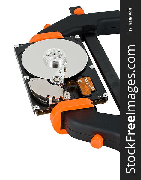 The computer hard disk clamped in a manual clamp  on a white background. Concept for data compression.