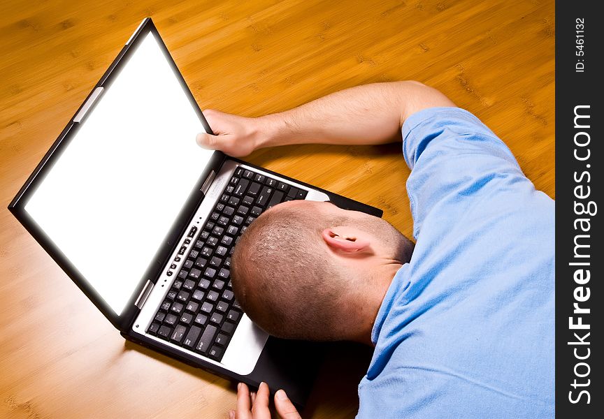 Man on wood floor work with laptop. Man on wood floor work with laptop