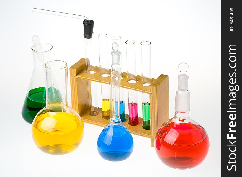 Various colorful glass laboratory ware on a white background. Various colorful glass laboratory ware on a white background