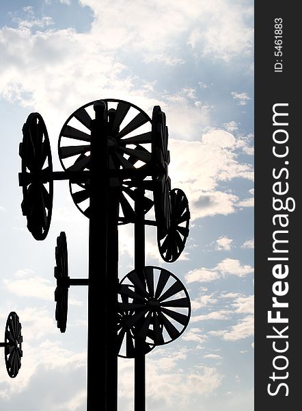 Silhouette of a group of windmills,very contract to the bright sky.