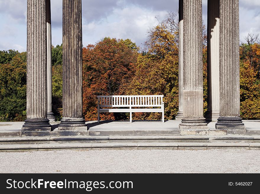 White Bench Between Columns, Trees Public Park, Autumn, Berlin Germany