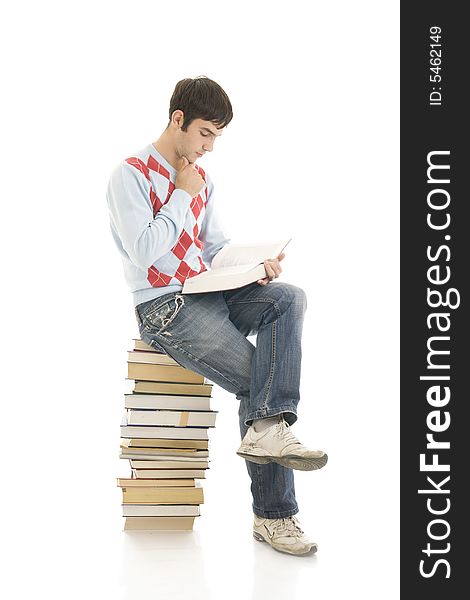 The young student with the books isolated on a white background