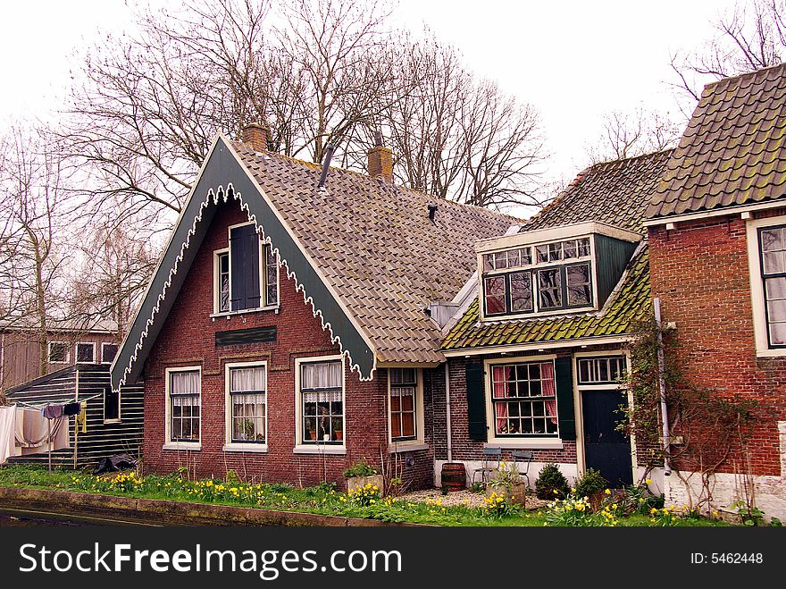 An old farm house at the waterside. An old farm house at the waterside