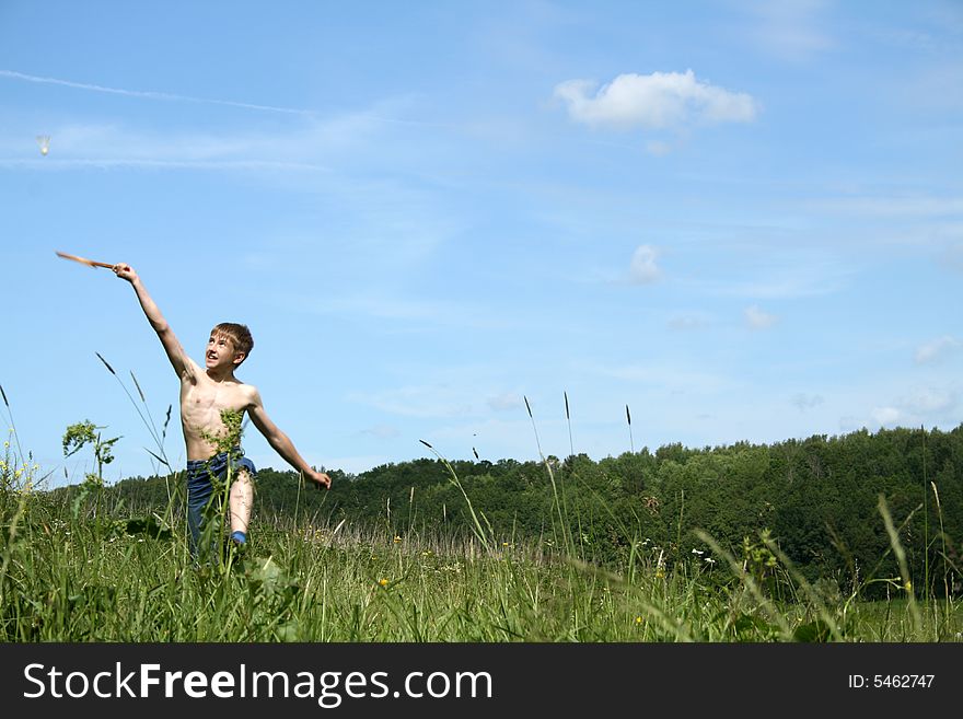 Boy Playing At Badminton