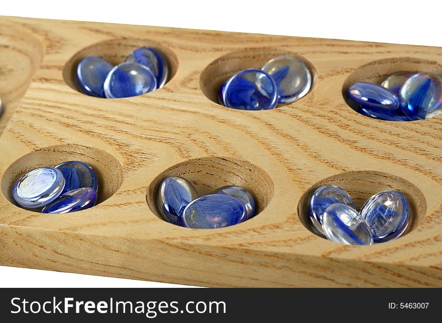 A Wooden mancala game with blue stones