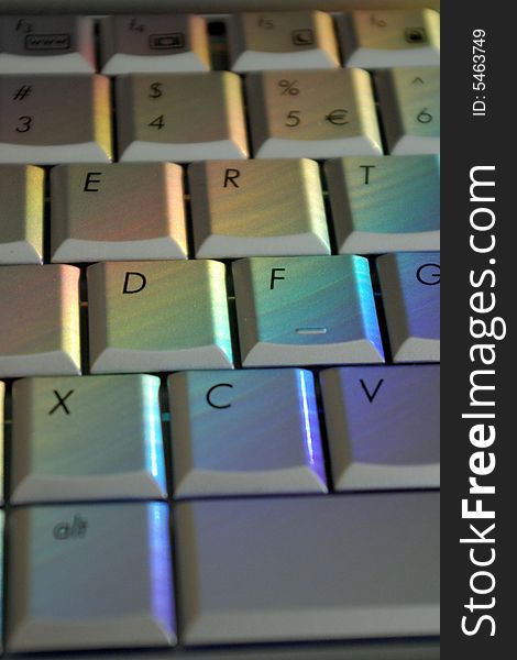 Colorful computer keys on keyboard. No computer manipulation. Rainbow colors are real reflection. Colorful computer keys on keyboard. No computer manipulation. Rainbow colors are real reflection.