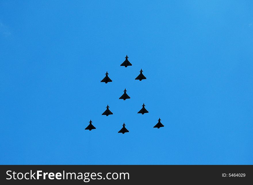 Formation of fighter planes with a blue sky background. Formation of fighter planes with a blue sky background